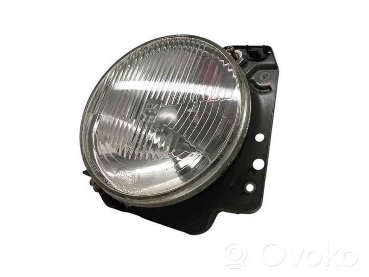 Volkswagen Golf II Lampa przednia 7R0114551