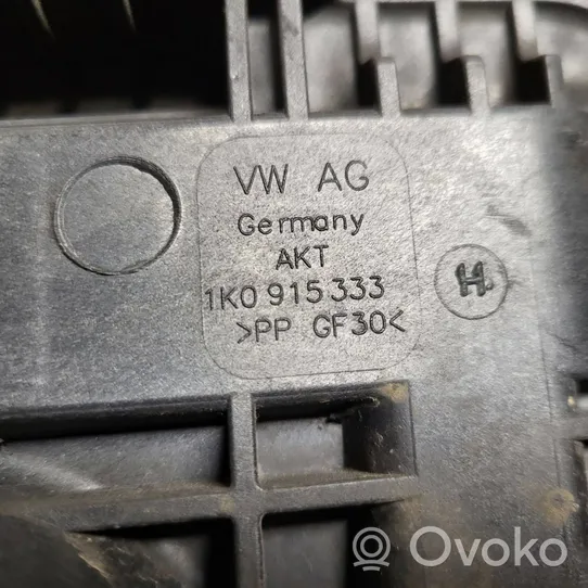 Volkswagen PASSAT B7 Support boîte de batterie 1K0915333