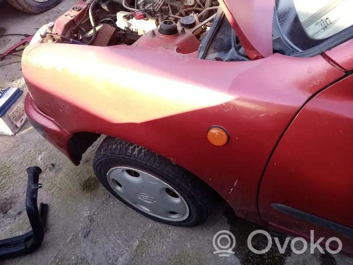 Nissan Micra C+C Błotnik przedni 6310150B30