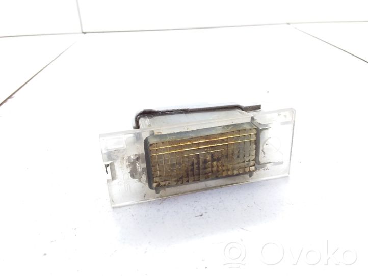 Opel Movano A Lampa oświetlenia tylnej tablicy rejestracyjnej 7700796163