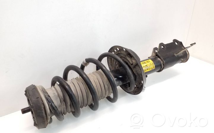 Opel Zafira C Front shock absorber with coil spring 13338923