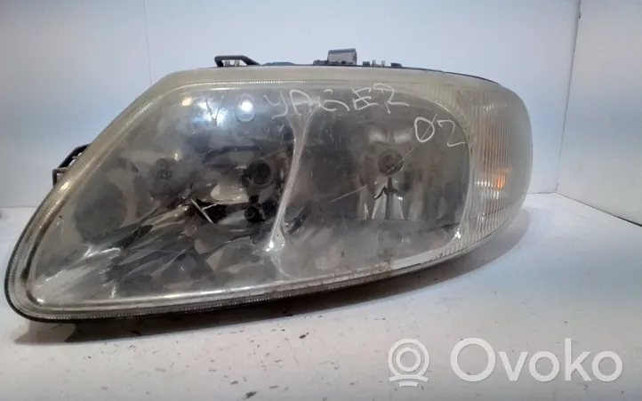 Chrysler Voyager Lampa przednia 04857711AB