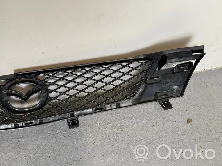 Mazda Demio Augšējais režģis D34250712