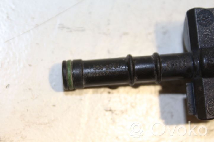 Volkswagen Tiguan Headlight washer spray nozzle 130860009