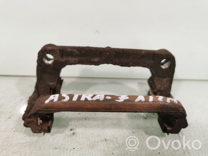 Opel Astra J Supporto della pinza del freno posteriore 