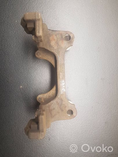 Volkswagen PASSAT B7 Plaquette / support d'étrier avant 