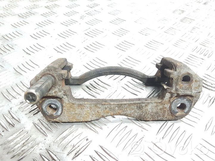 Mazda 323 Plaquette / support d'étrier avant 