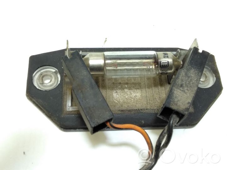 Ford Mondeo Mk III Lampa oświetlenia tylnej tablicy rejestracyjnej 1S7113550AC