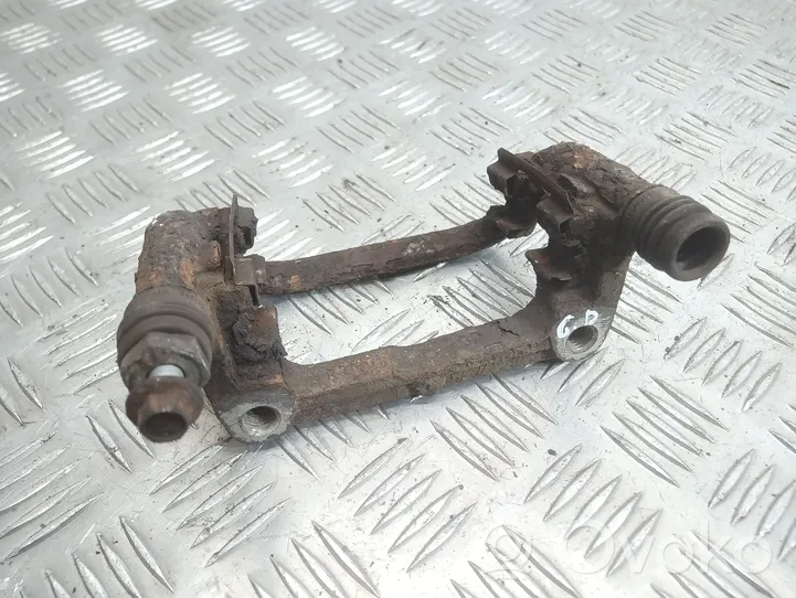 Opel Astra J Supporto della pinza del freno posteriore 