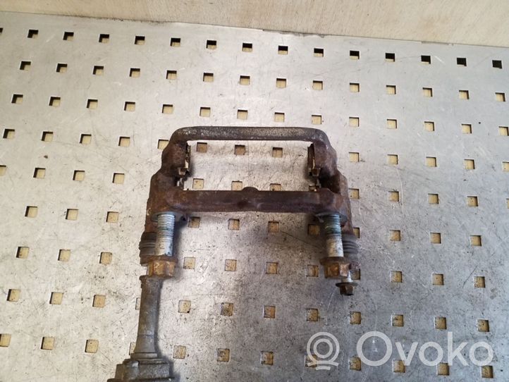 Opel Astra J Supporto della pinza del freno posteriore 