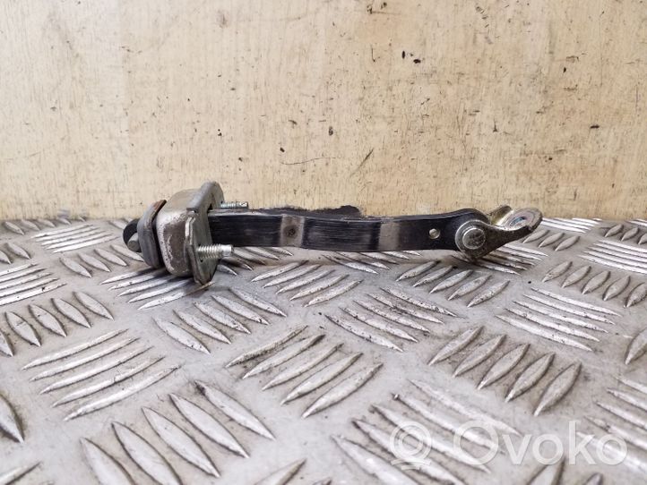 Subaru Outback Rear door check strap stopper 