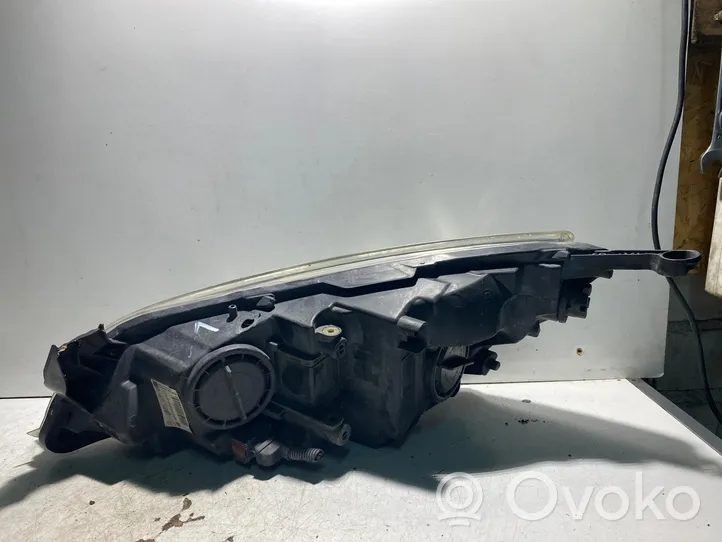 Opel Astra J Lampa przednia 1LG01001104