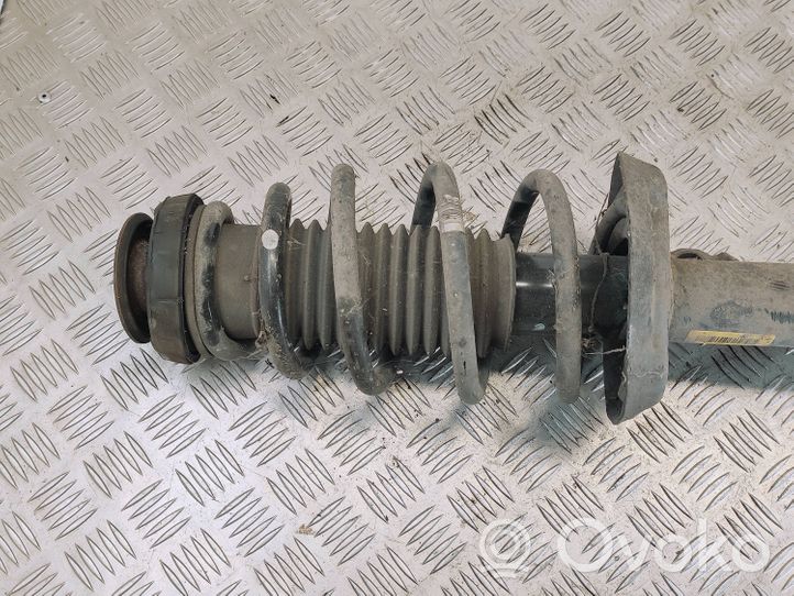 Opel Zafira C Front shock absorber with coil spring 13338923