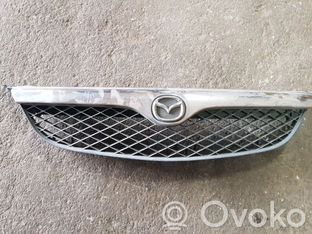Mazda 626 Front bumper upper radiator grill 