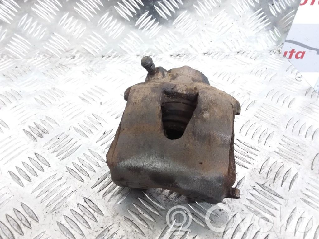 Volkswagen Golf V Front brake caliper 
