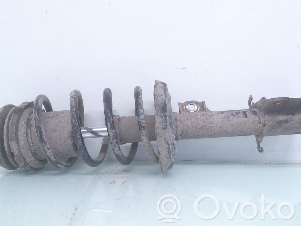Front shock absorber with coil spring
