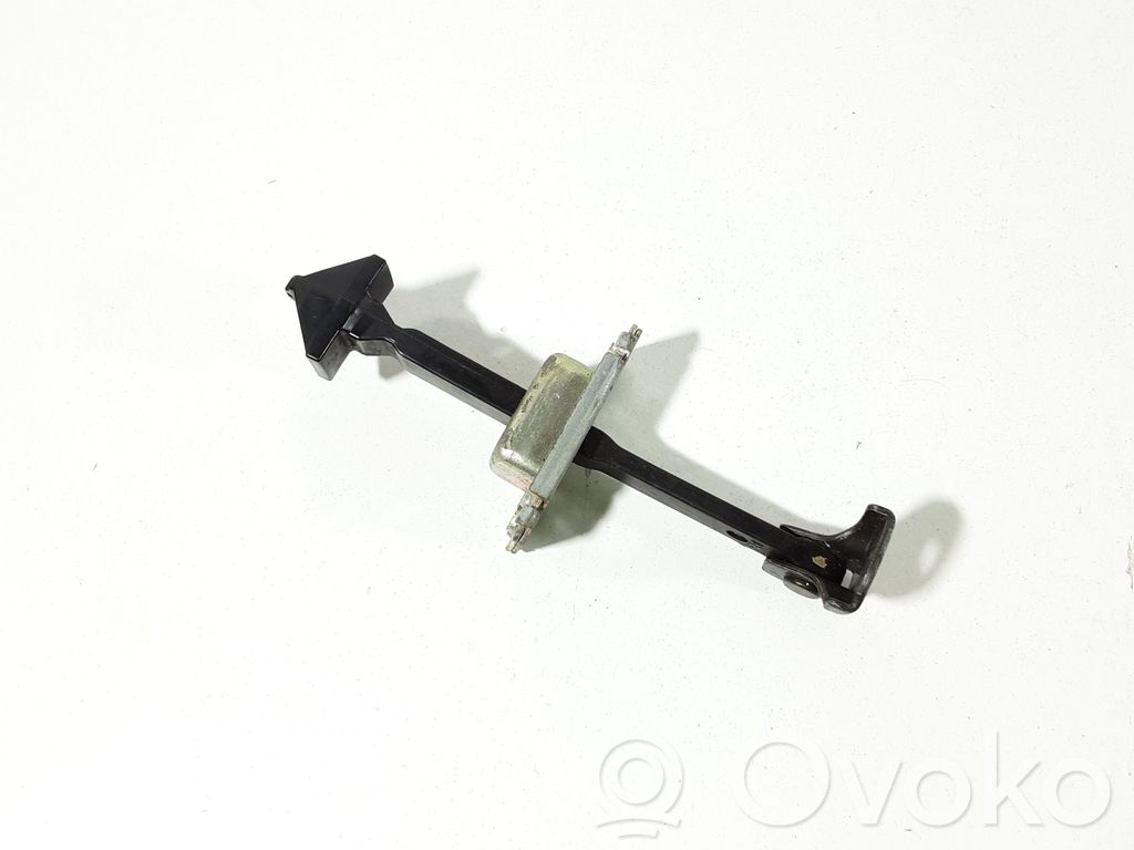 Front door check strap stopper