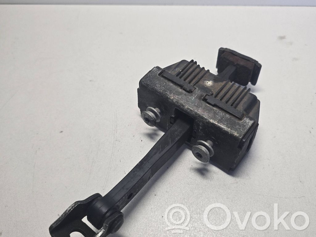 Front door check strap stopper   7033609