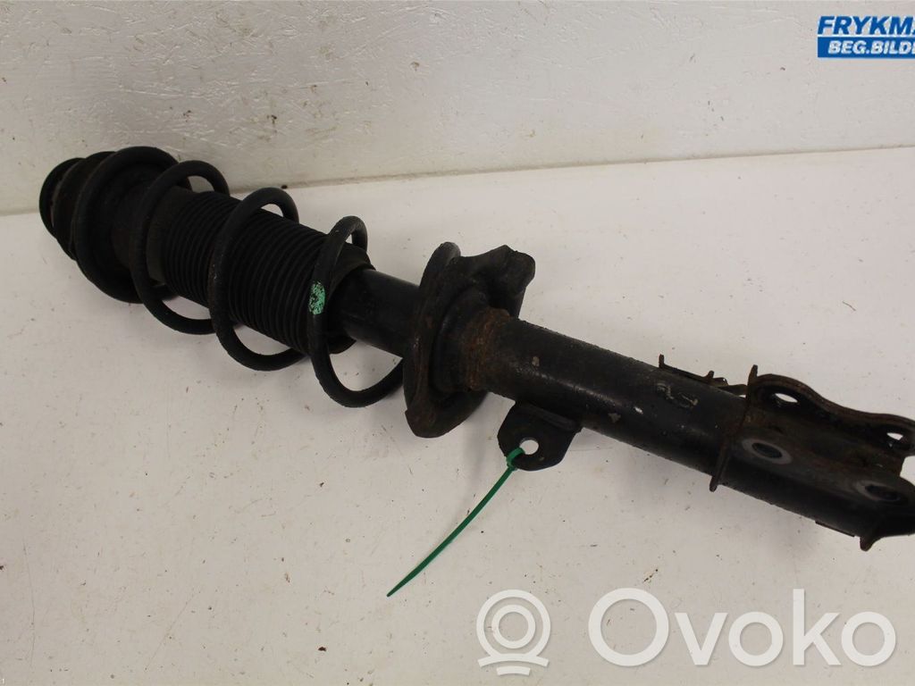 Nissan Note (E12) Front shock absorber with coil spring 