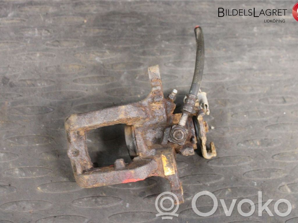 Opel Astra J Tylny zacisk hamulcowy 