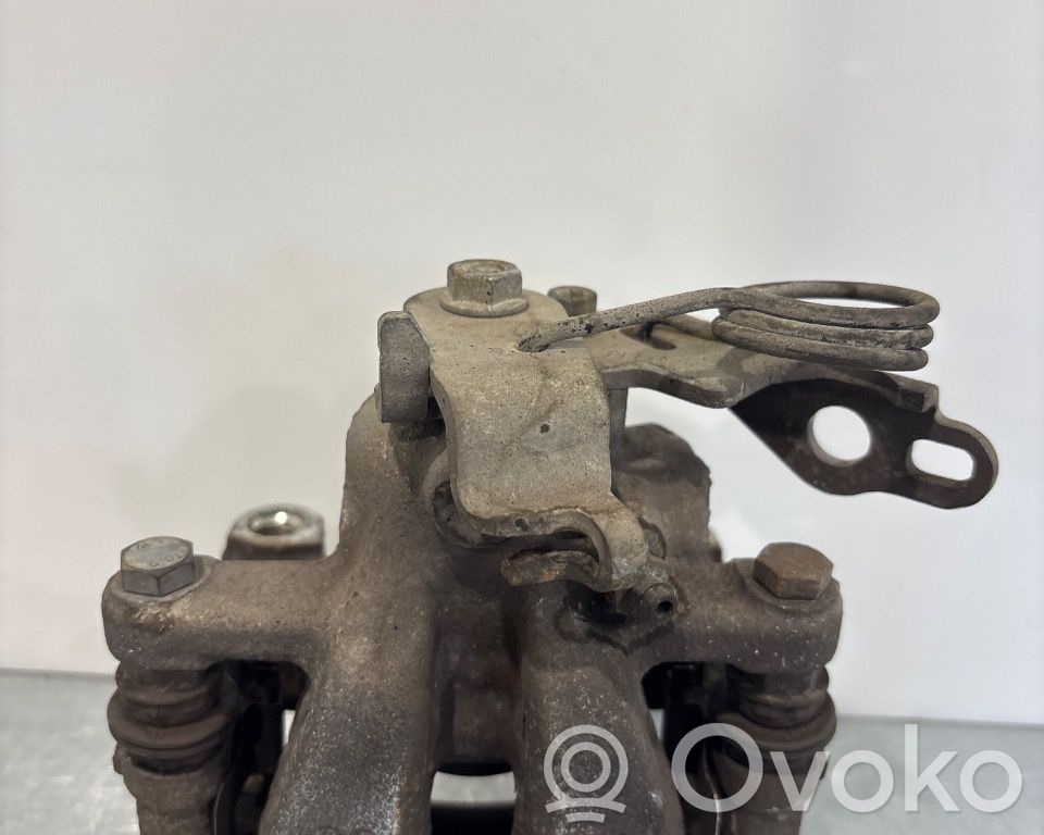 Ford Mondeo MK IV Tylny zacisk hamulcowy 