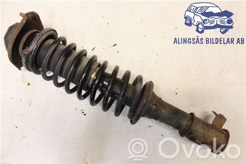 Front shock absorber with coil spring