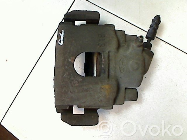 Mazda 121 SM Zacisk hamulcowy przedni 