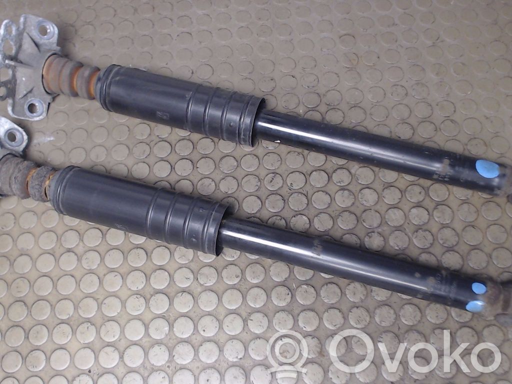 Opel Corsa D Amortiguador delantero con muelle espiral 