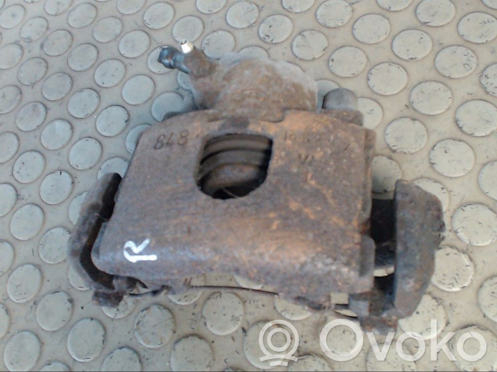Mazda 121 SM Zacisk hamulcowy przedni 