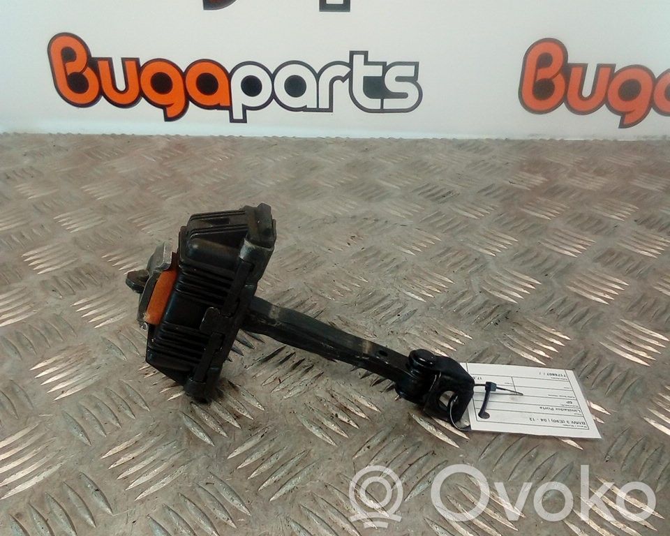 Front door check strap stopper   7176807