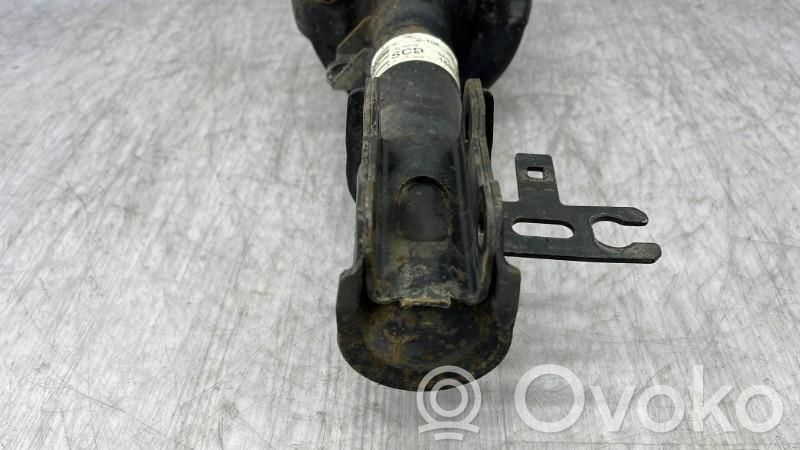 Opel Astra H Amortyzator osi przedniej ze sprężyną 