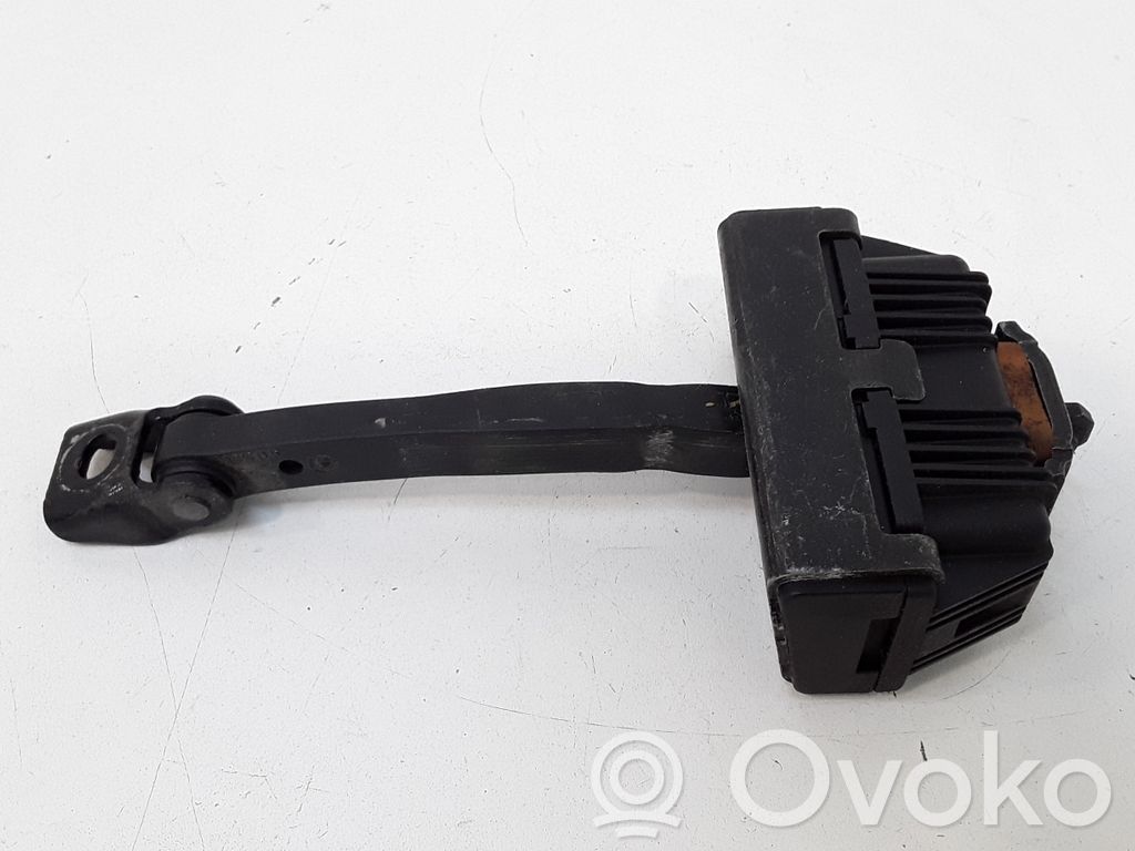 Front door check strap stopper