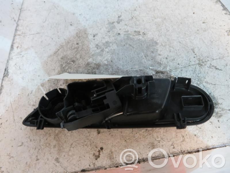Ford Fiesta Klamka wewnętrzna drzwi przednich 