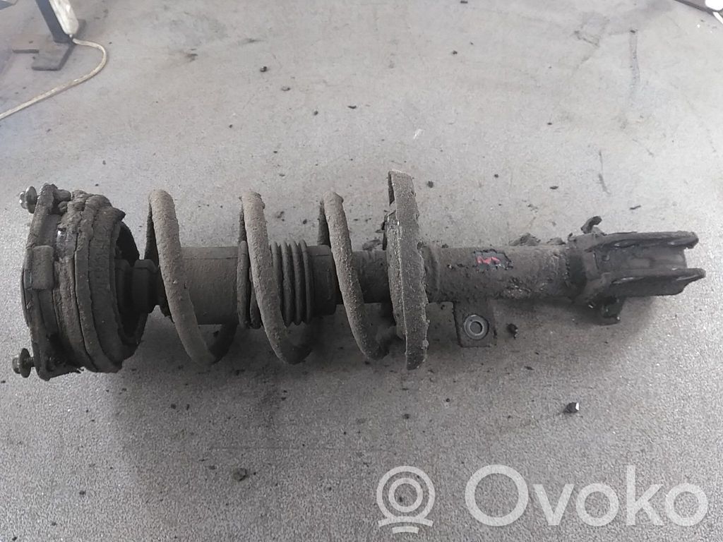 Nissan Note (E11) Priekšpusē amortizators ar atsperi 