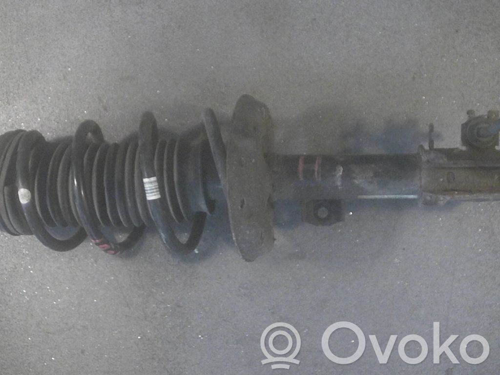 Opel Corsa D Amortyzator osi przedniej ze sprężyną 