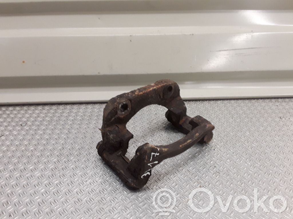 Plaquette / support d'étrier avant