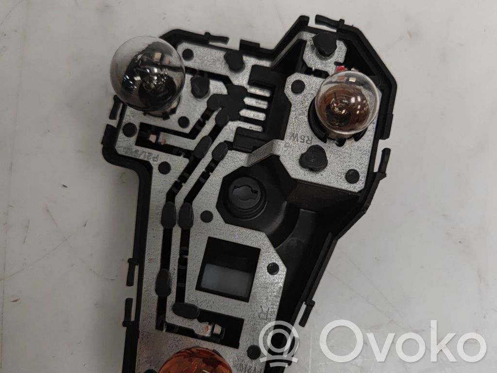 Tail light bulb cover holder