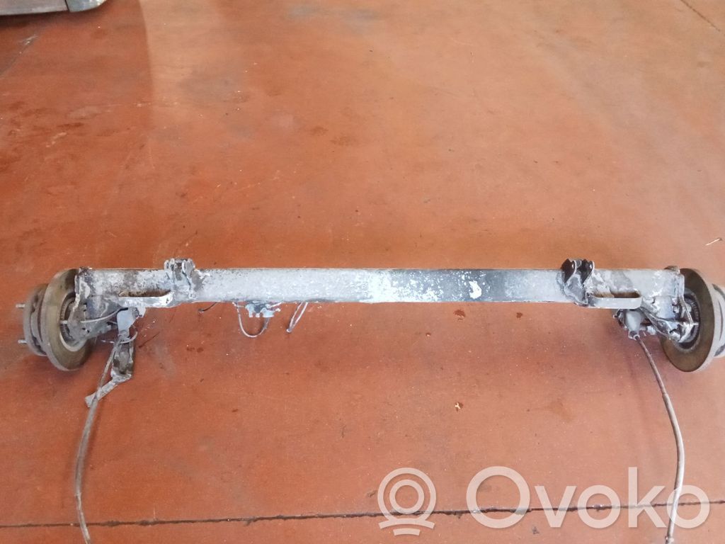 Rear axle beam with reductor