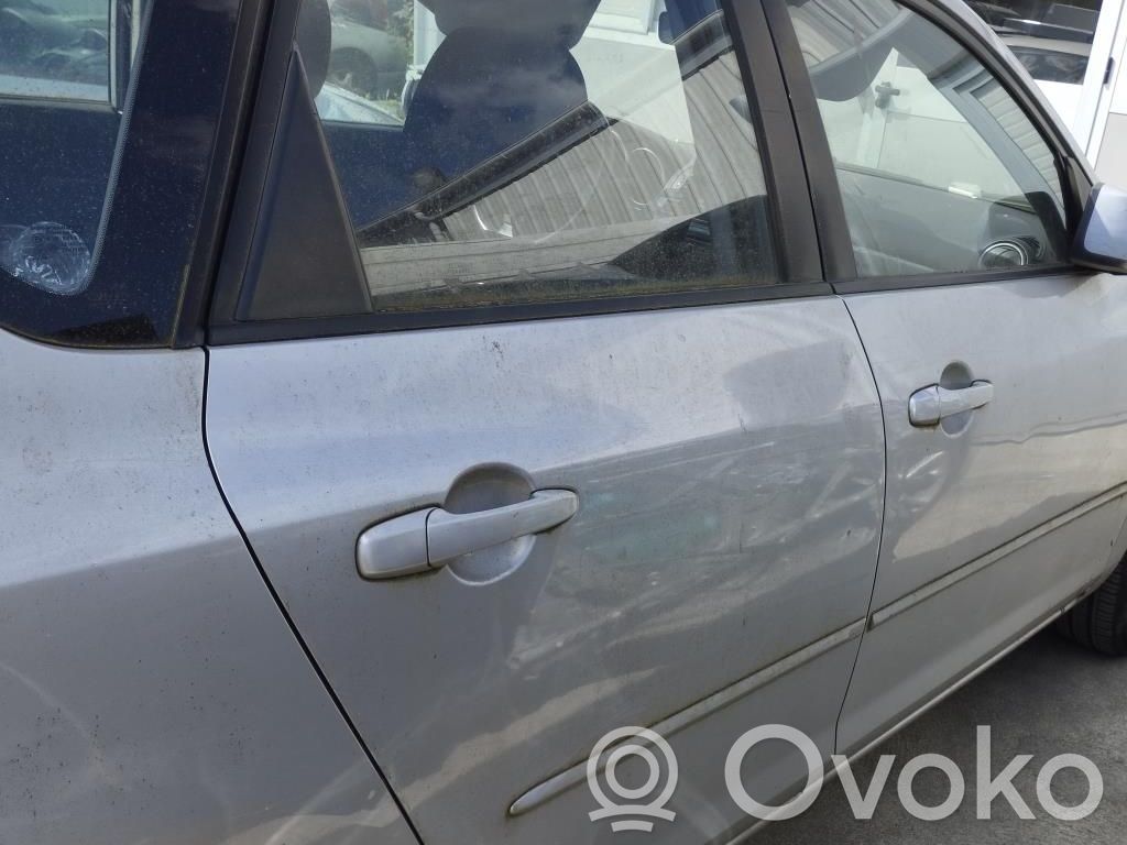 Mazda 3 I Zamek drzwi tylnych 