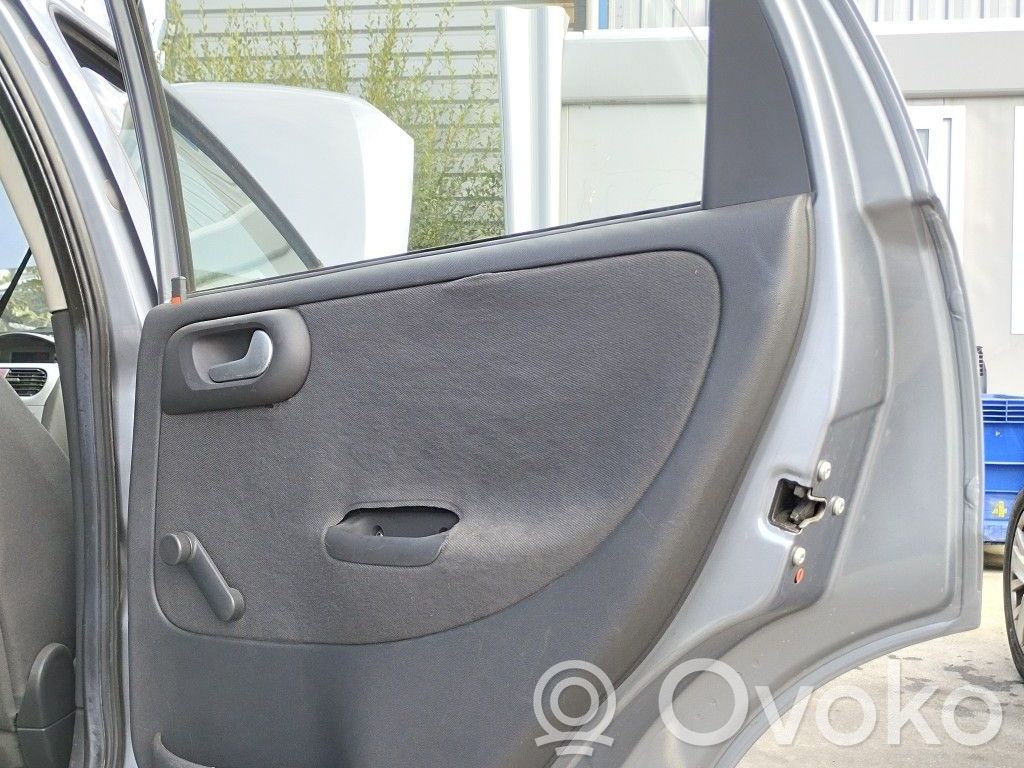 Opel Corsa C Regulador manual de la ventanilla trasera 