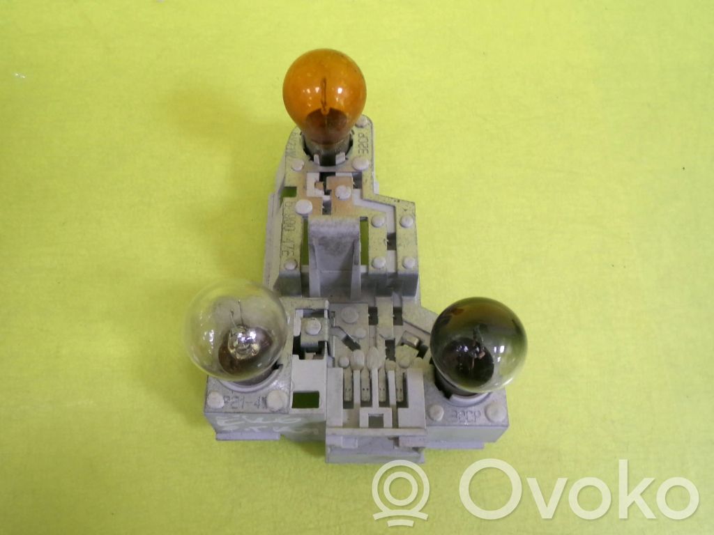 Tail light bulb cover holder