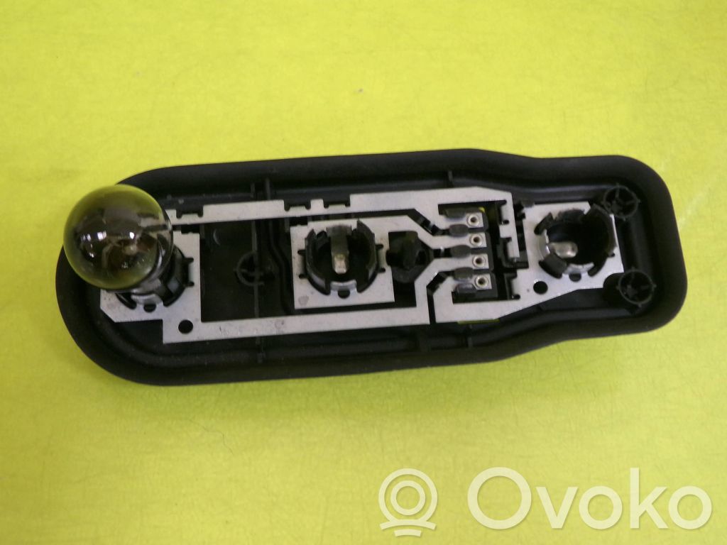 Tail light bulb cover holder