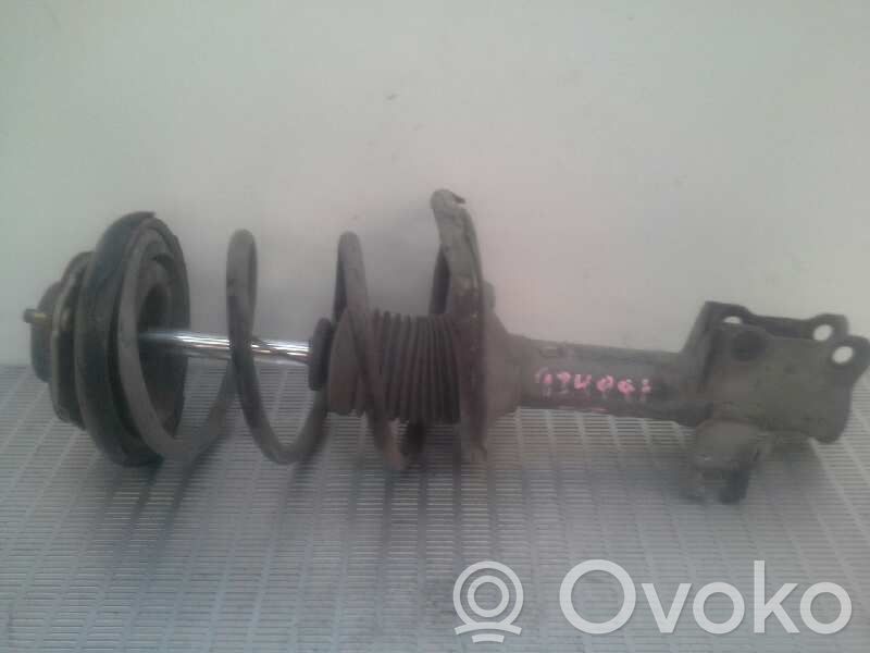 Nissan Almera N16 Front shock absorber with coil spring 