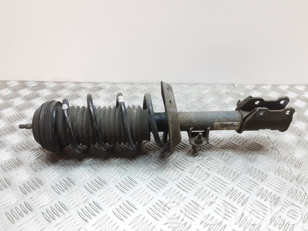 Opel Corsa D Front shock absorber with coil spring 