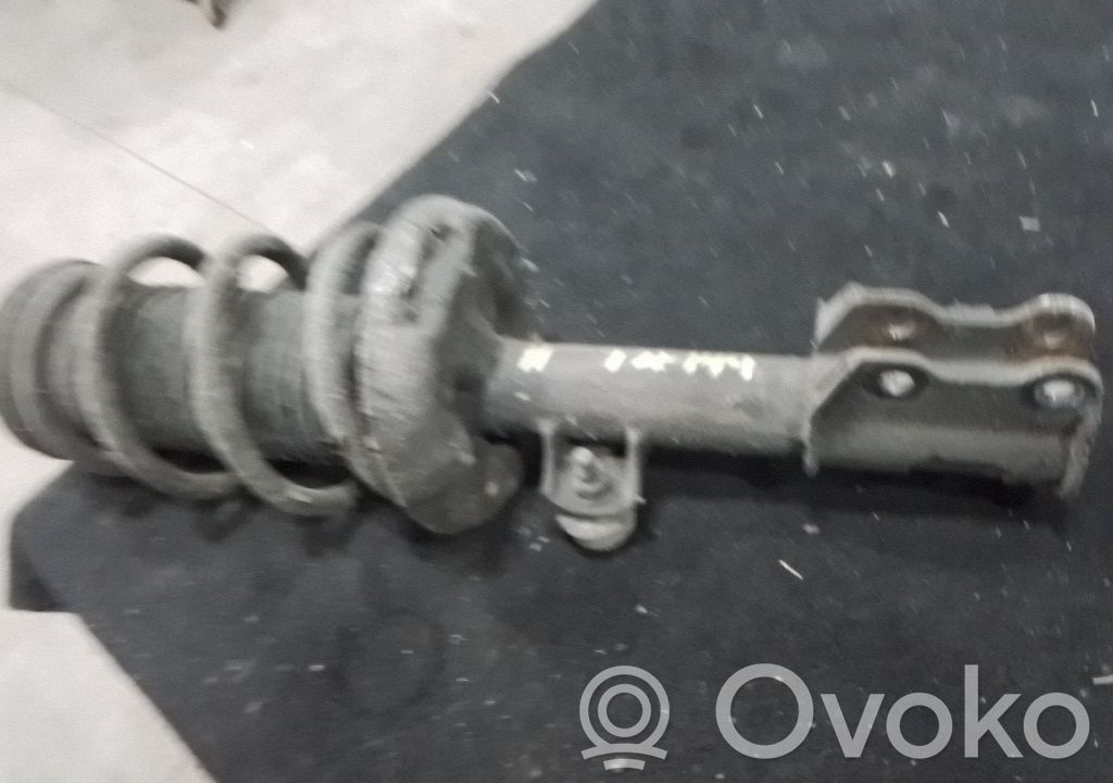 Front shock absorber with coil spring