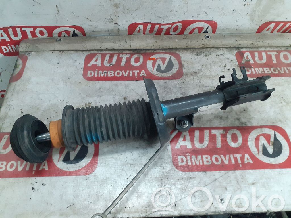 Opel Corsa D Front shock absorber with coil spring 