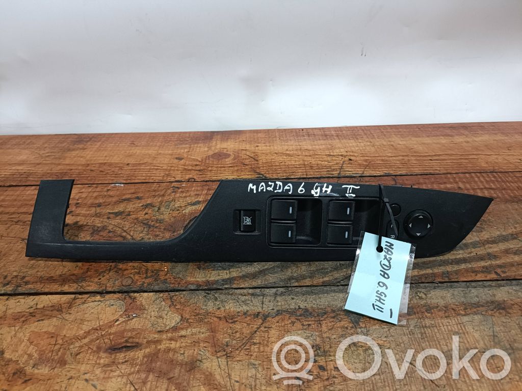 Front door window switch trim   GS1D684L6