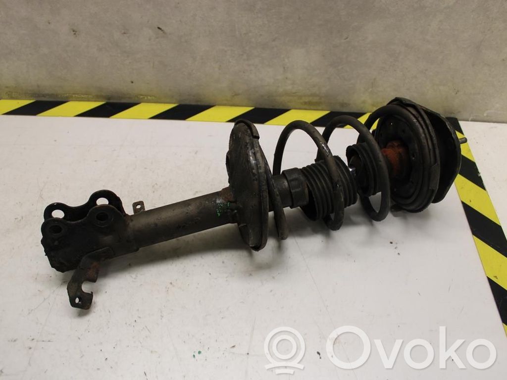 Toyota Corolla E110 Priekinis amortizatorius su spyruokle 