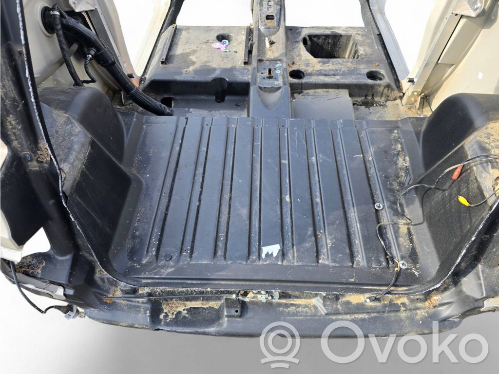 Trunk bottom trim panel