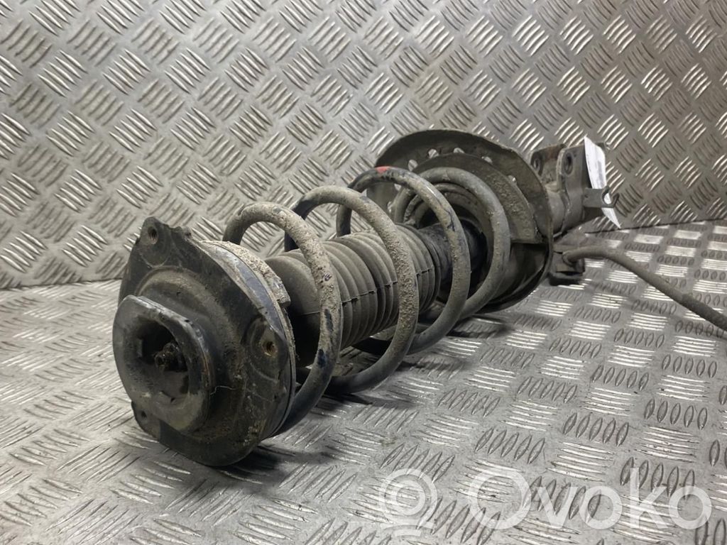 Nissan Juke I F15 Ammortizzatore anteriore con molla elicoidale 